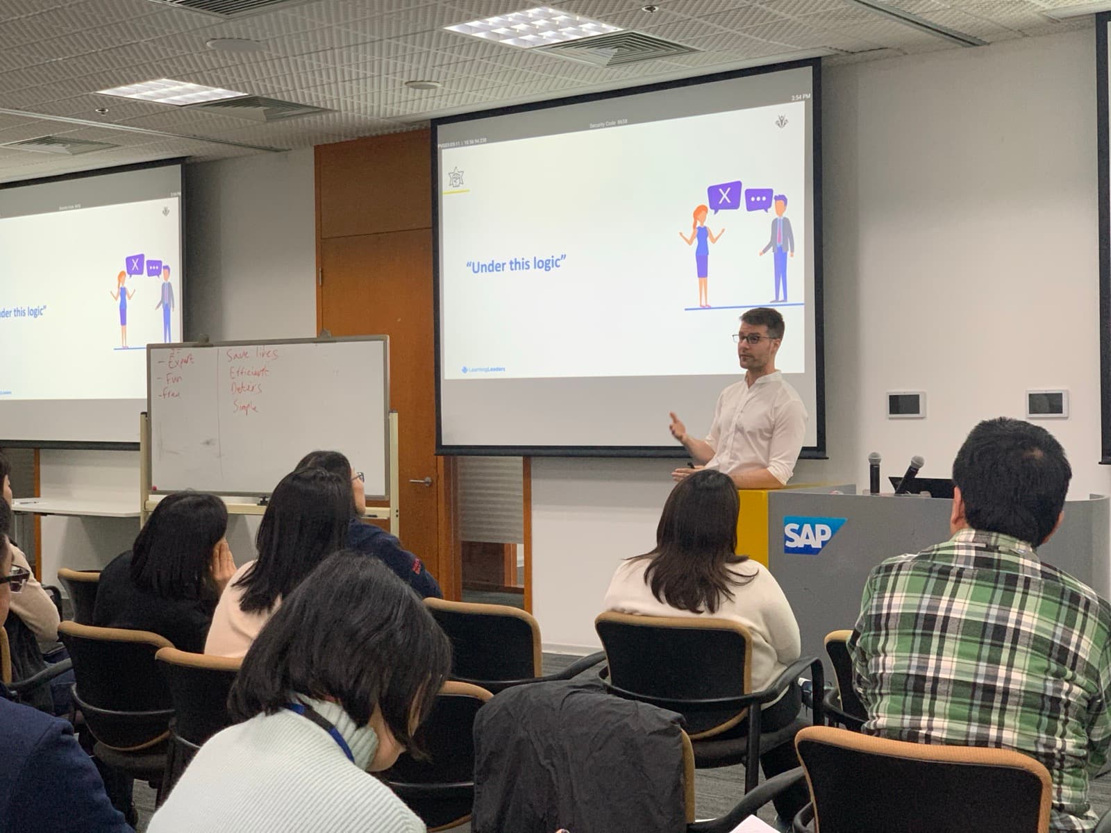 Michael delivering a presentation to SAP employees during a Learning Day session