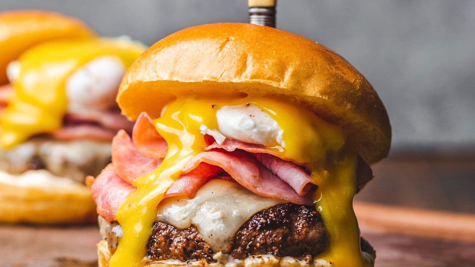 Gourmet burger with melted cheese in fast casual restaurant